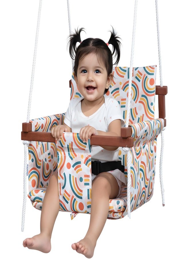 Cherilo أرجوحة شيريلو الخشبية للأطفال من 6 أشهر إلى 5 سنوات | أرجوحة معلقة داخلية وخارجية للأطفال | أرجوحة مريحة وآمنة مع وسادتين وحزام أمان | أرجوحة بإطار خشبي متين للأطفال - تصميم متجه مجاني - Image 1